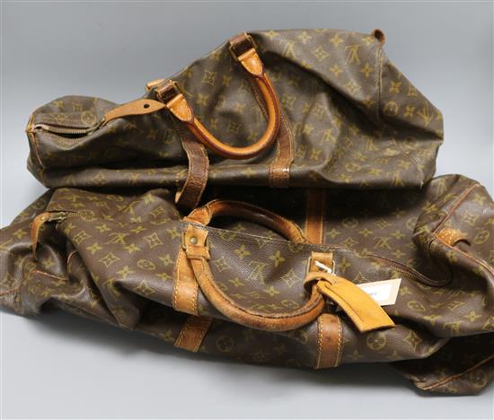 A Louis Vuitton monogrammed holdall and a similar smaller bag